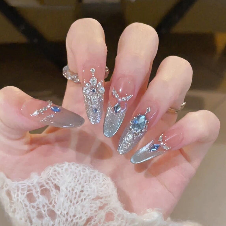 Glamorous artificial nails with sparkling rhinestone accents Kalsten