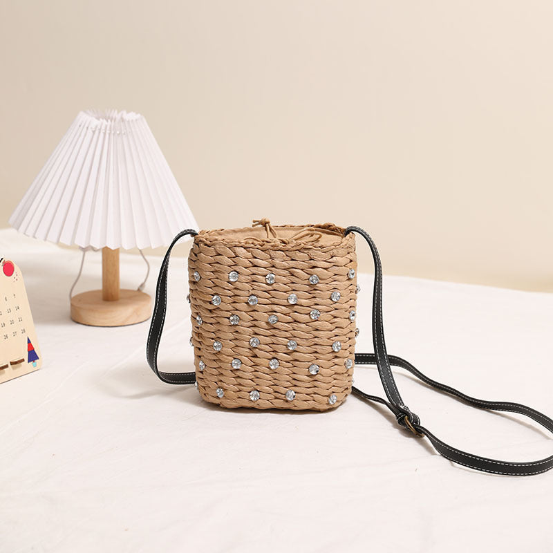 Bag made of woven natural material with sparkling appliqués Kalsten