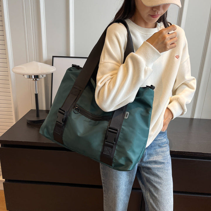 Spacious sports duffel bag with ergonomic carrying handles and water-repellent material Kalsten