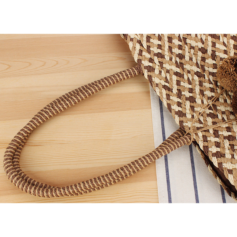 Summer wicker handbag with pom poms Kalsten
