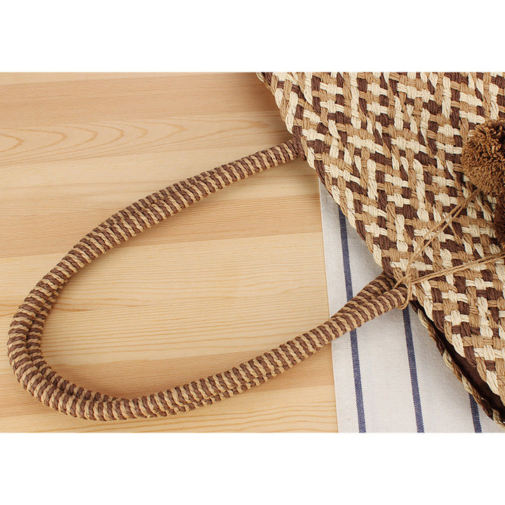 Summer wicker handbag with pom poms Kalsten