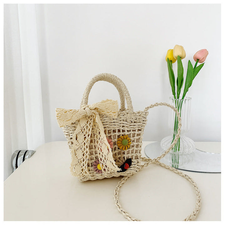 Playful basket bag with floral appliqués Kalsten