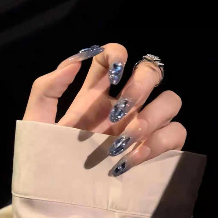 Glamorous artificial nails with delicate flower and glitter effects Kalsten
