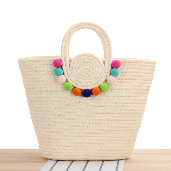 Fashionable handbag with playful pompom decoration Kalsten
