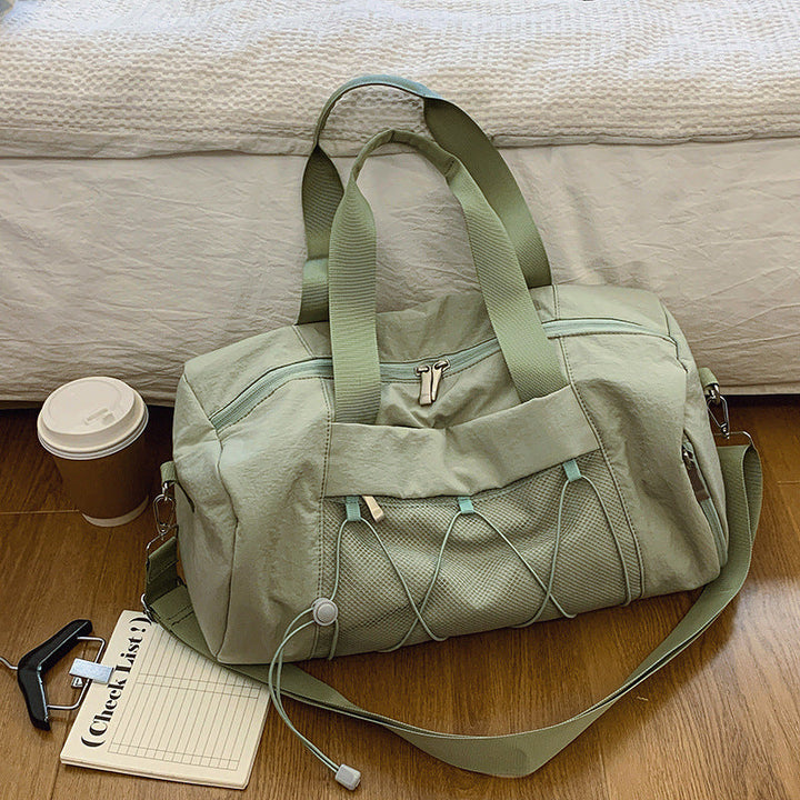 Sporty shoulder bag with adjustable carrying handles and breathable mesh material Kalsten