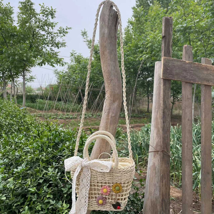 Playful basket bag with floral appliqués Kalsten