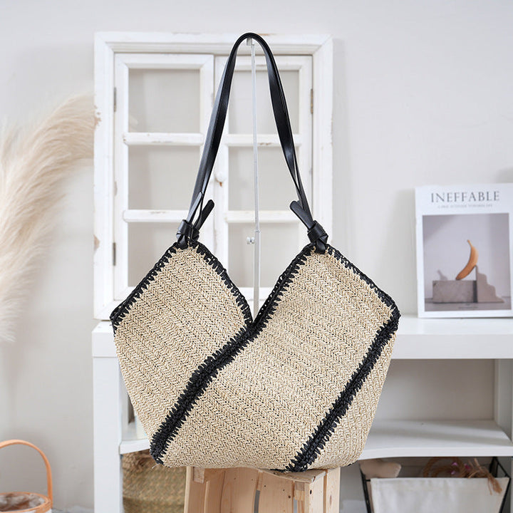 Handbag made of braided natural material with contrasting leather handles Kalsten