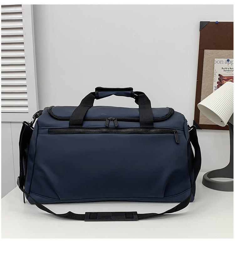 Sporty travel bag with reinforced carrying handles and multiple compartments Kalsten