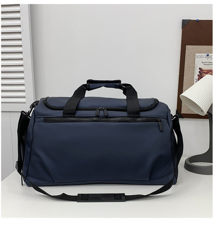 Sporty travel bag with reinforced carrying handles and multiple compartments Kalsten