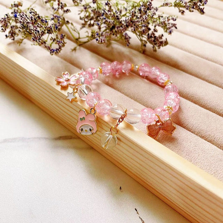 Elegant bracelet with animal and glitter pendants Kalsten