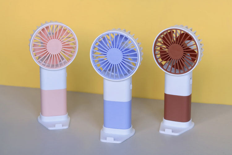 Unisex handheld fan with ergonomic design and USB charging function Kalsten