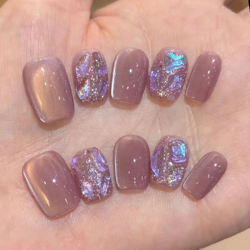 Acrylic nails with glitter accents and modern designs Kalsten