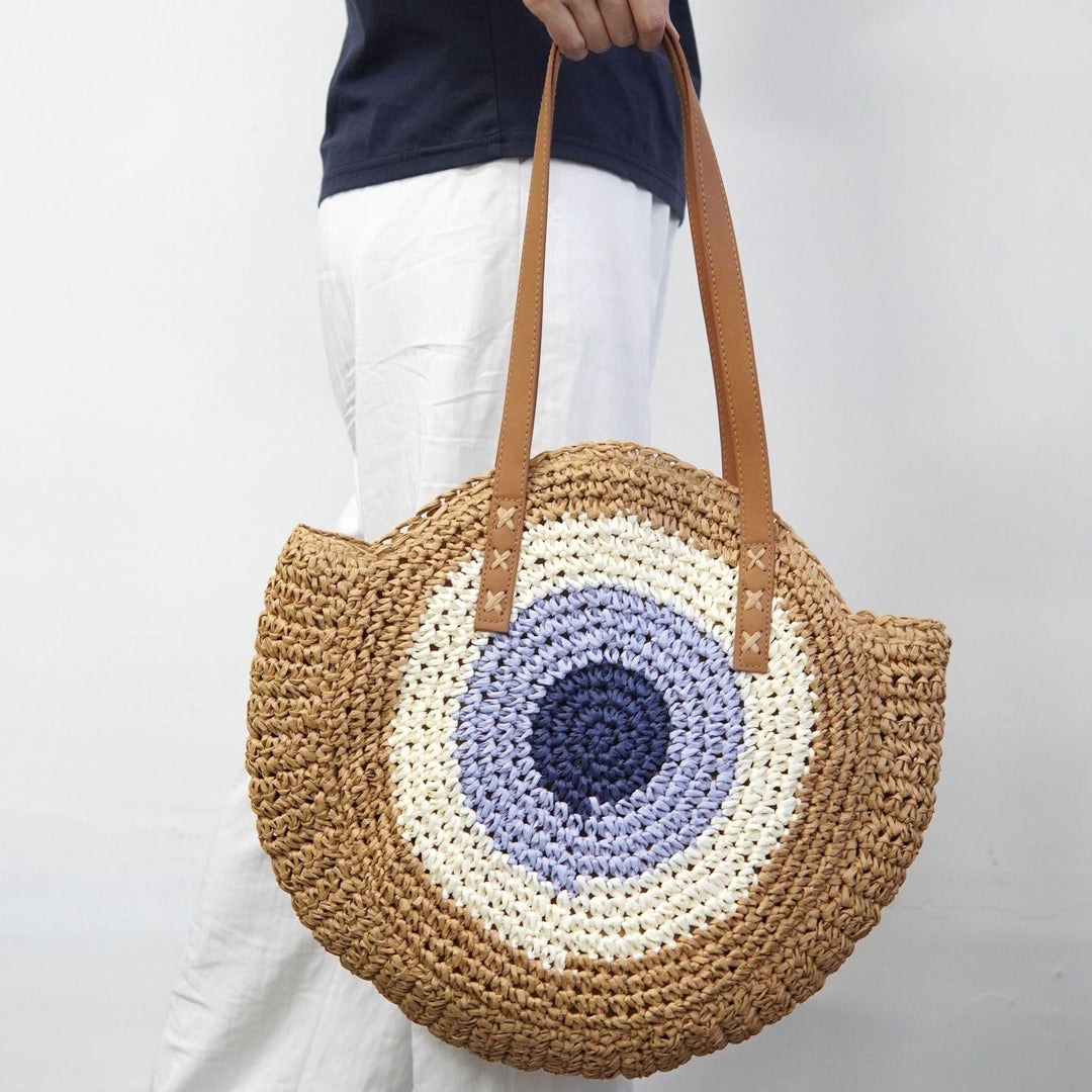 Braided basket bag with unique round design and elegant shoulder straps Kalsten