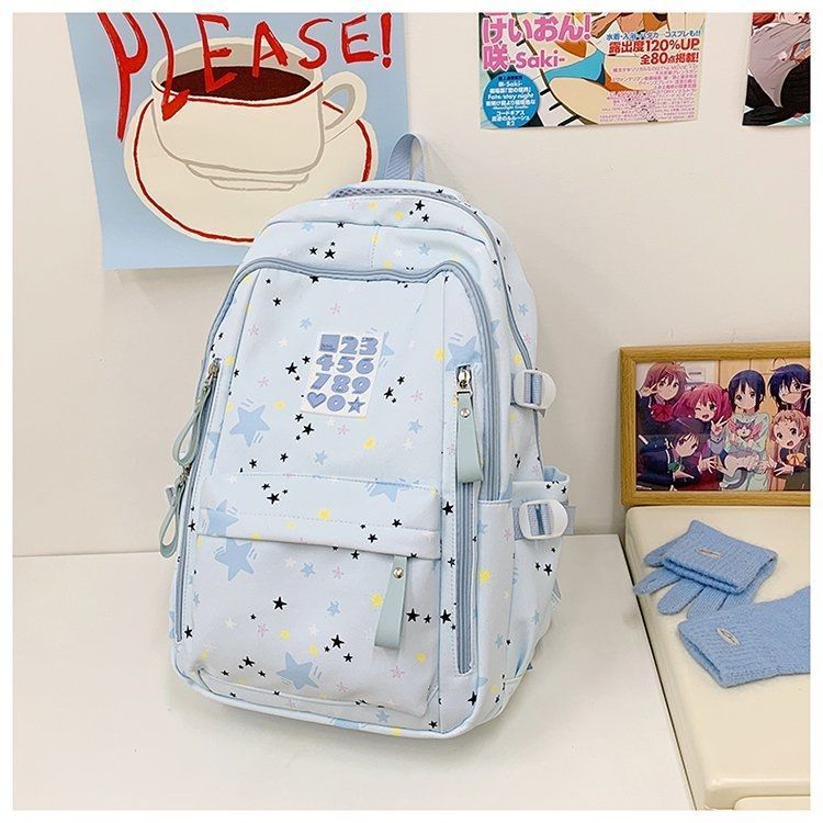 Playful backpack with star motifs and practical functions Kalsten