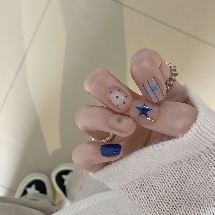 Artificial nails in modern design with geometric and sparkling accents Kalsten