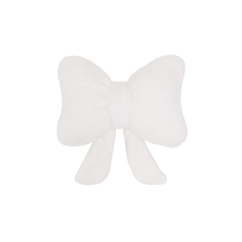 plush bow-shaped decorative throw cushion with long tails and faux-fur texture Kalsten