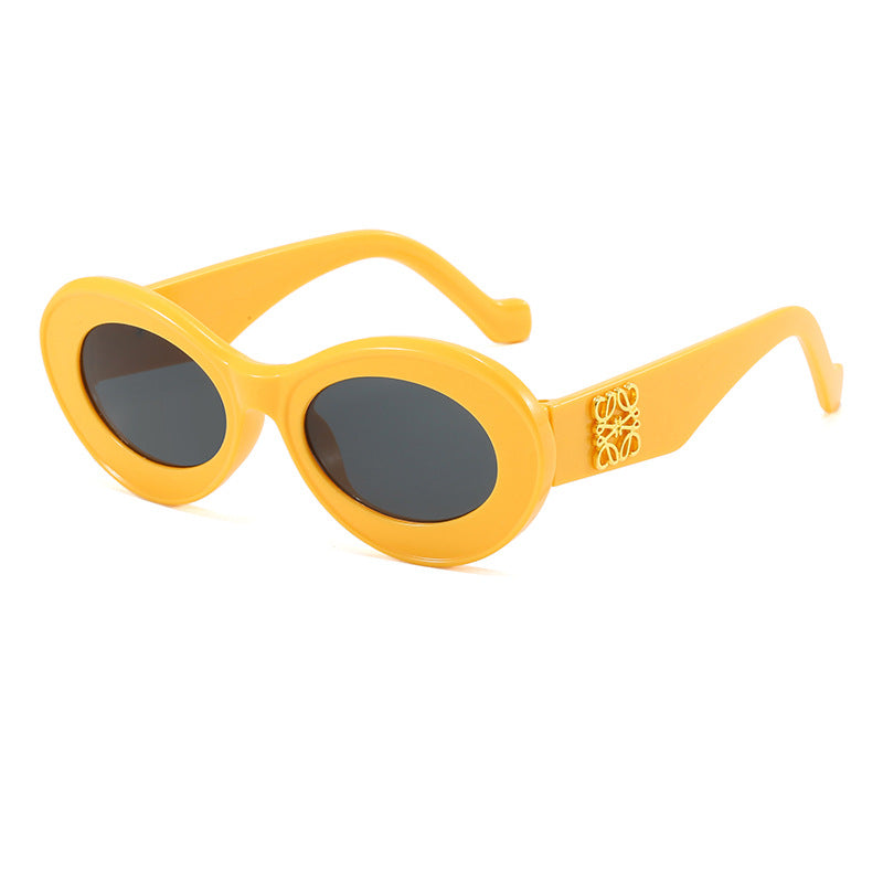 Women's fashionable sunglasses with oval frame and golden applications Kalsten