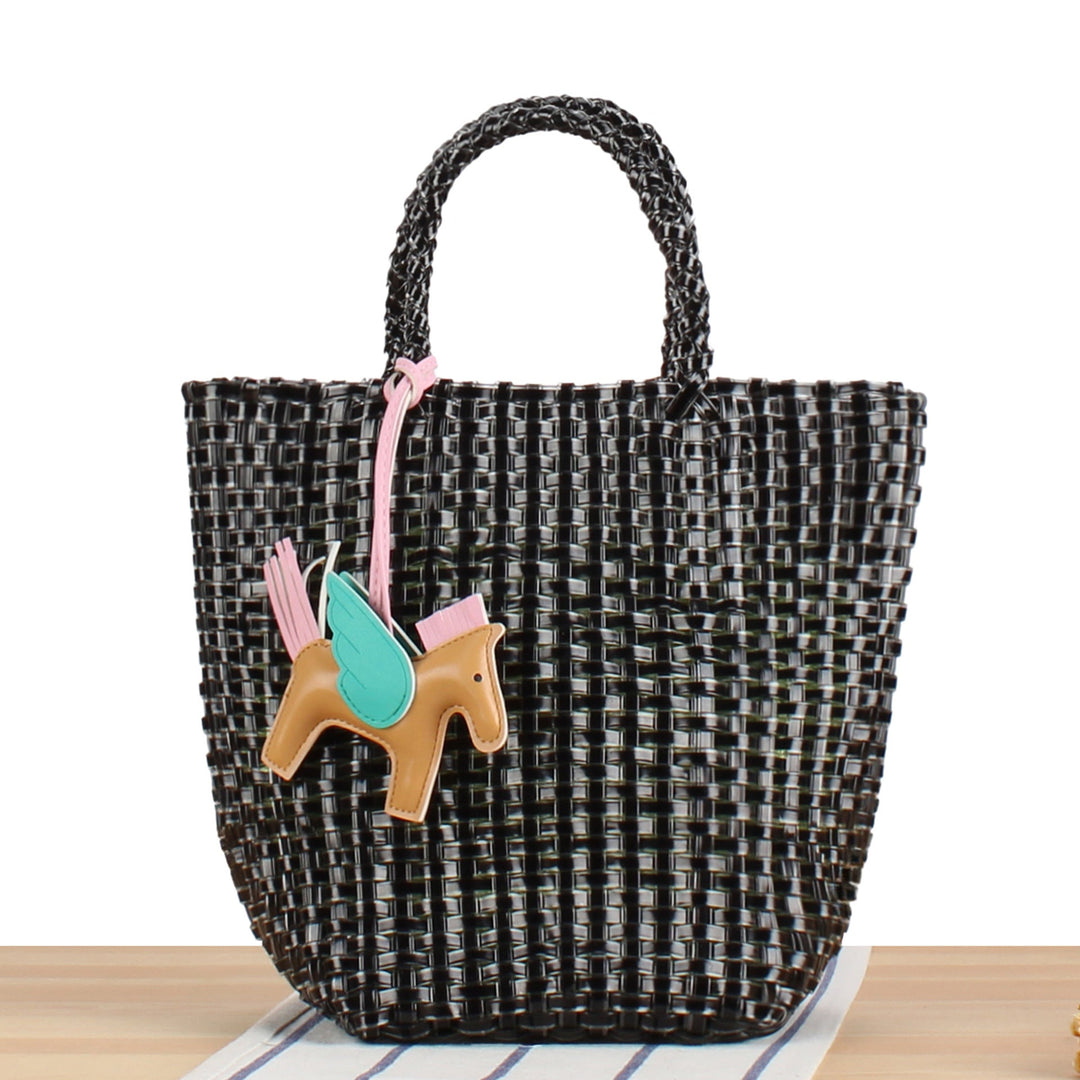 Playful basket bag with unique pendant Kalsten
