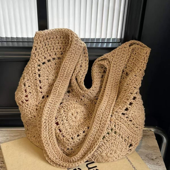 Handbag made of braided natural material with tassel details Kalsten