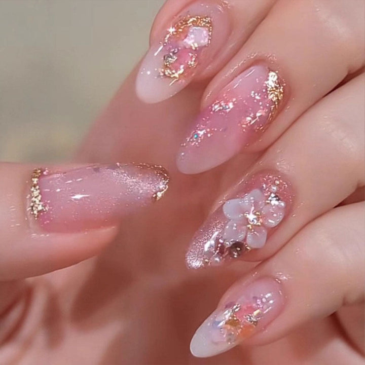 Artificial nails with delicate floral decorations and glitter effects Kalsten
