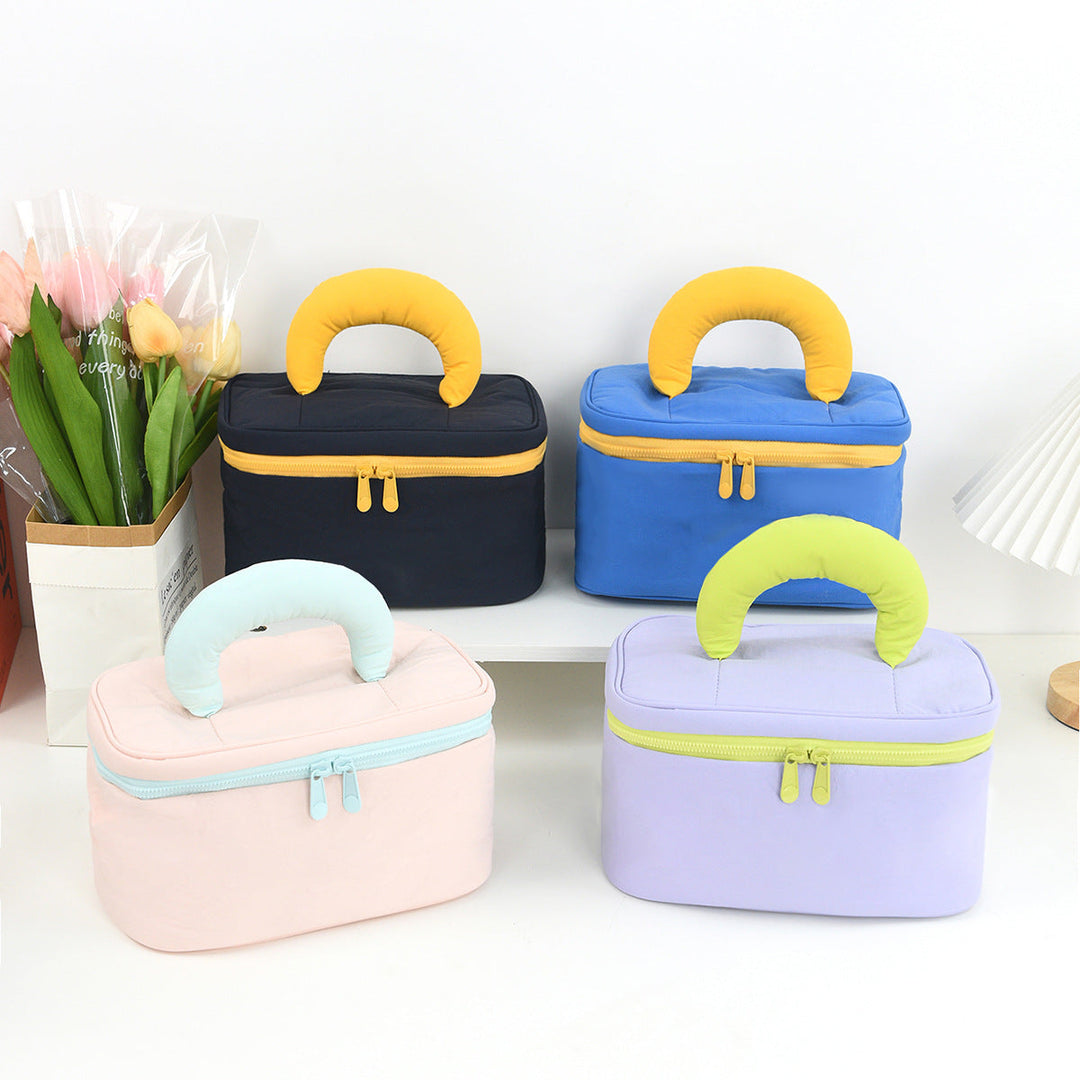 Cosmetic organizer with ergonomic carrying handle Kalsten