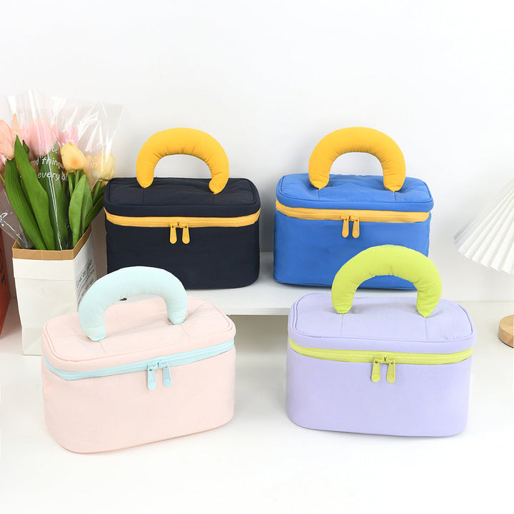 Cosmetic organizer with ergonomic carrying handle Kalsten