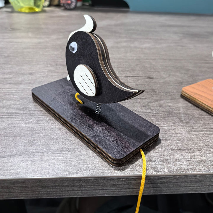 Unisex nan movable wooden bird table figure made of plywood with spiral spring and pull line Kalsten