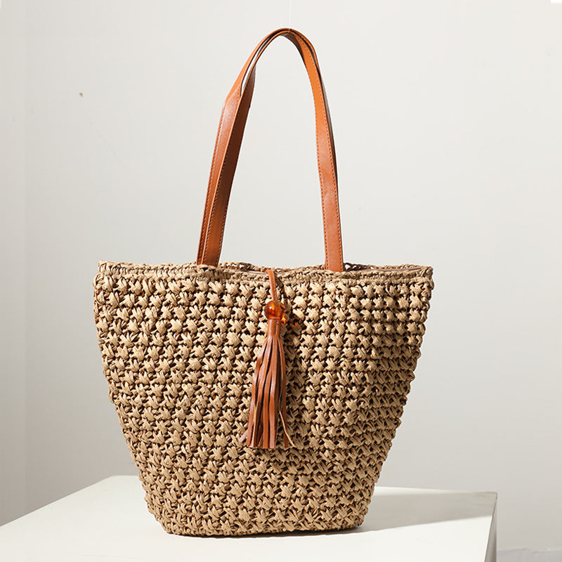 Handcrafted basket bag with fashionable tassel detail Kalsten