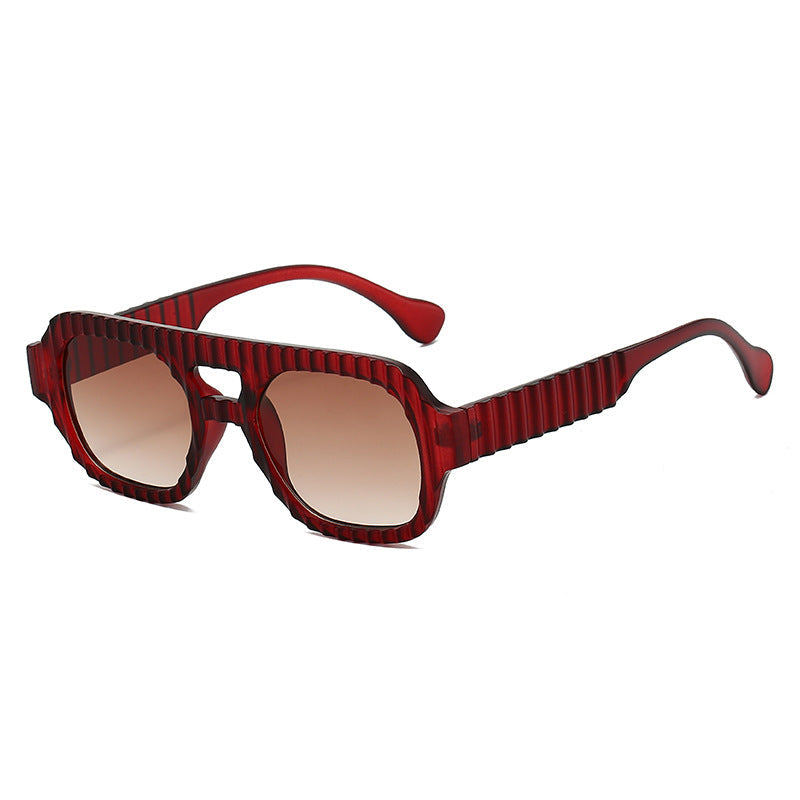 Ladies fashionable sunglasses in futuristic design with textured frame Kalsten