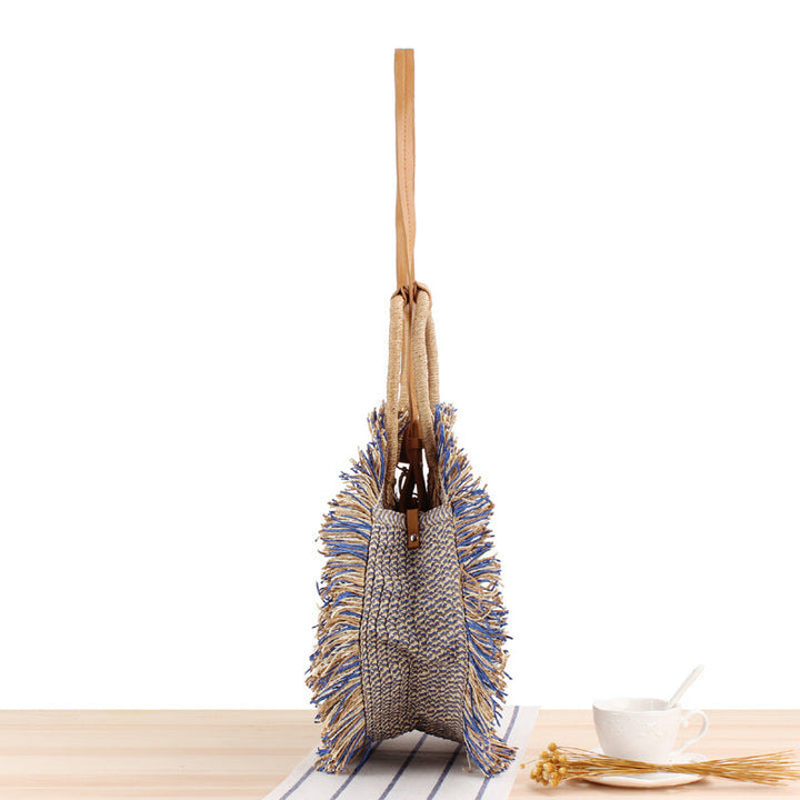 Round Bast shoulder bag with fringes and leather handles Kalsten
