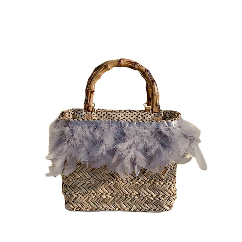 Elegant handbag with feathers and bamboo handles Kalsten