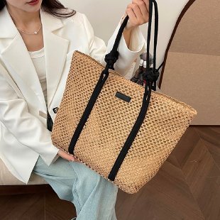 Beach bag made of hand-woven natural material with sturdy handles Kalsten