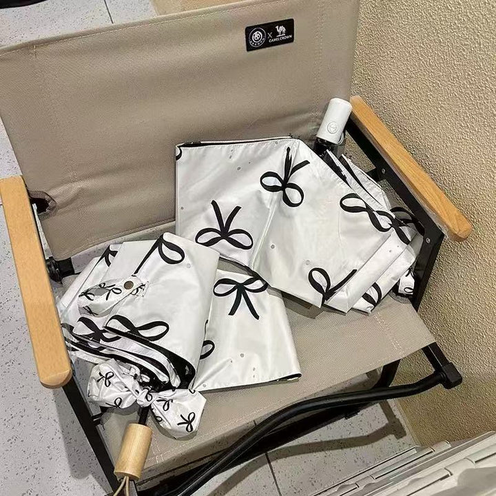 Women's foldable umbrella with elegant bow design Kalsten