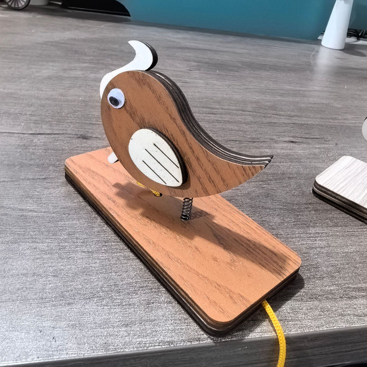 Unisex nan movable wooden bird table figure made of plywood with spiral spring and pull line Kalsten