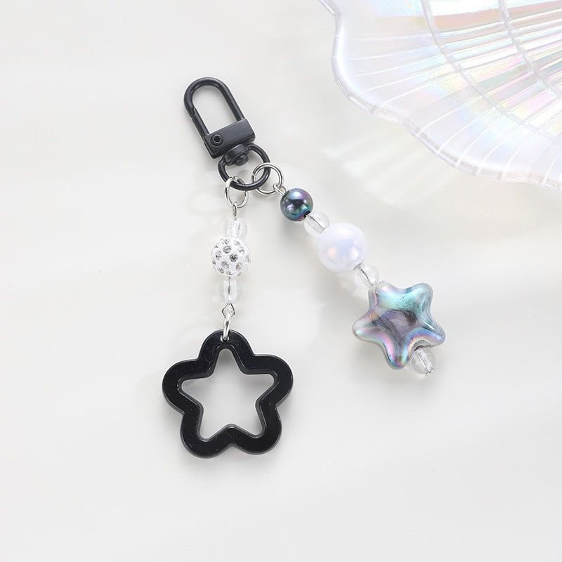 Playful keychain with floral and star motif Kalsten