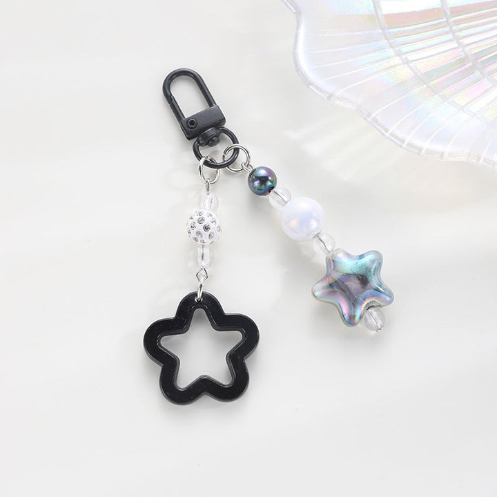 Playful keychain with floral and star motif Kalsten