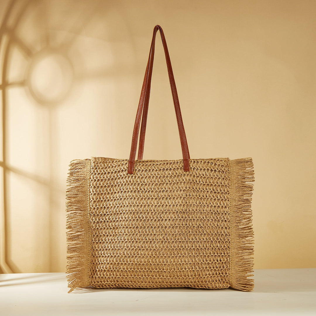 Beach bag made of raffia with fringed details Kalsten