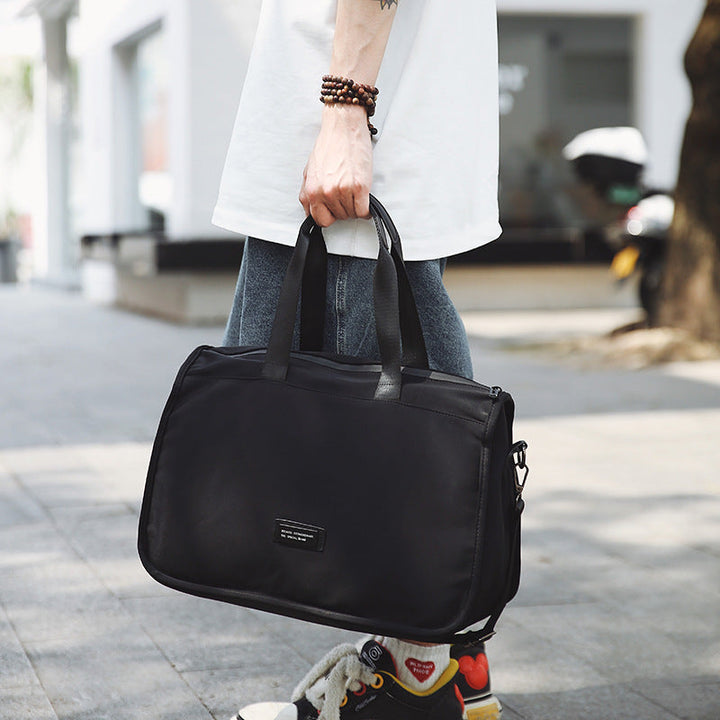 Sporty travel bag with ergonomic carrying handles and versatile compartments Kalsten