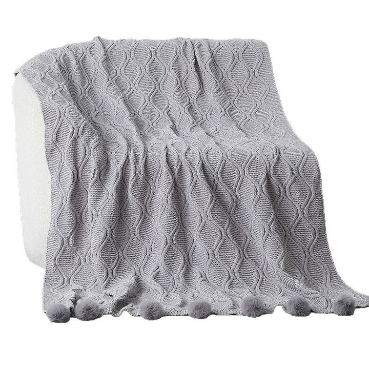 Ladies knit blanket with decorative pom poms Kalsten