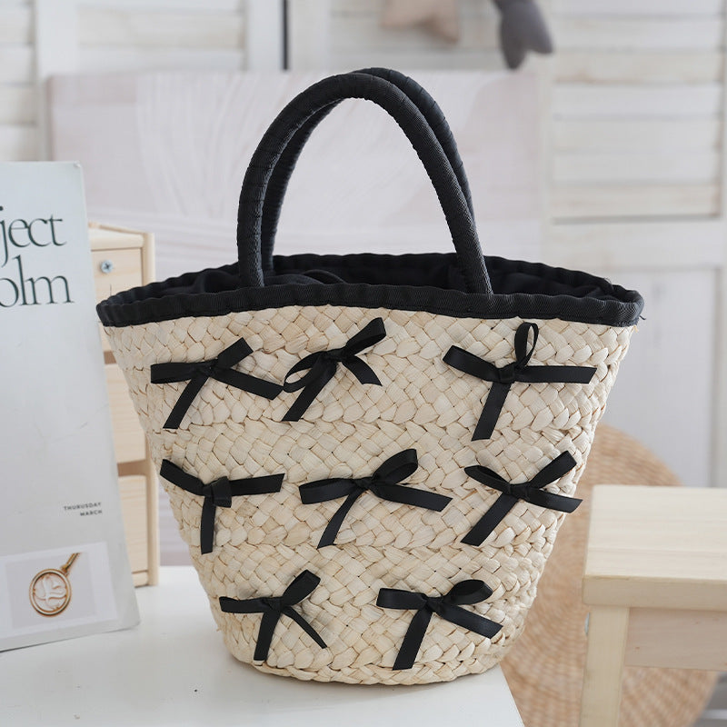 Basket bag with delicate bows and padded edge Kalsten