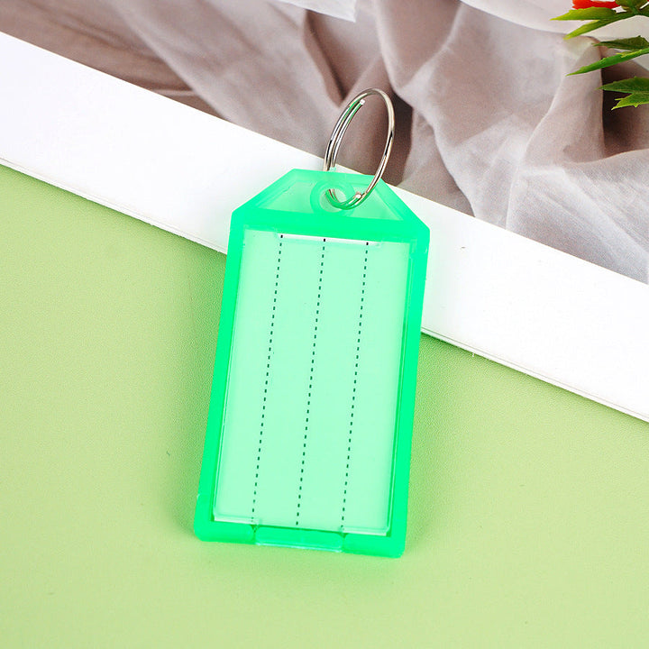 Unisex label tag with transparent sleeve and three writable fields Kalsten