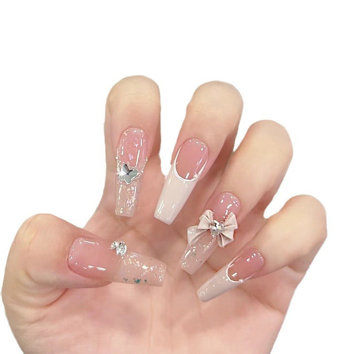 Artificial nails with glitter accents and playful motifs Kalsten