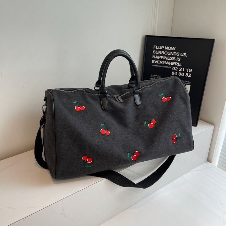 Sporty weekend bag with playful cherry pattern Kalsten