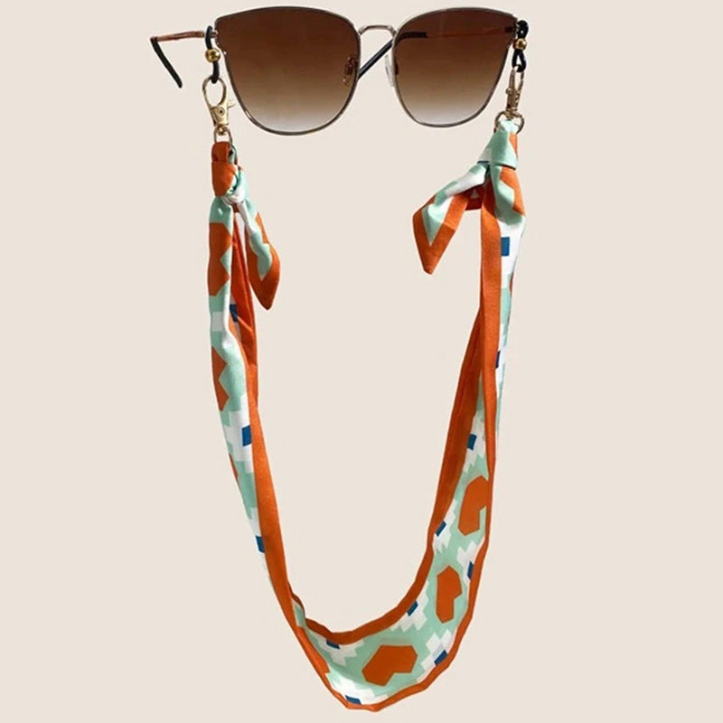 Fashionable fabric mask holder with floral motifs Kalsten