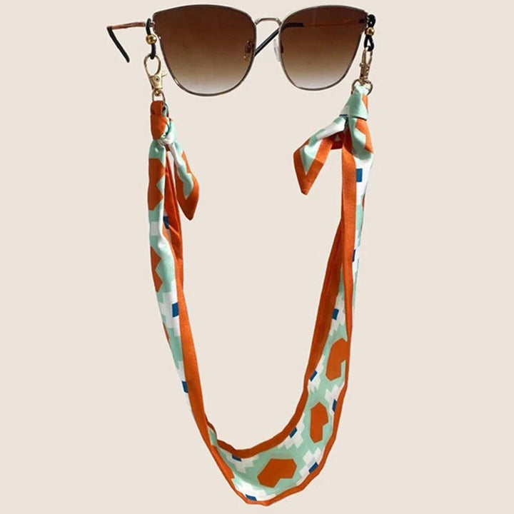 Fashionable fabric mask holder with floral motifs Kalsten