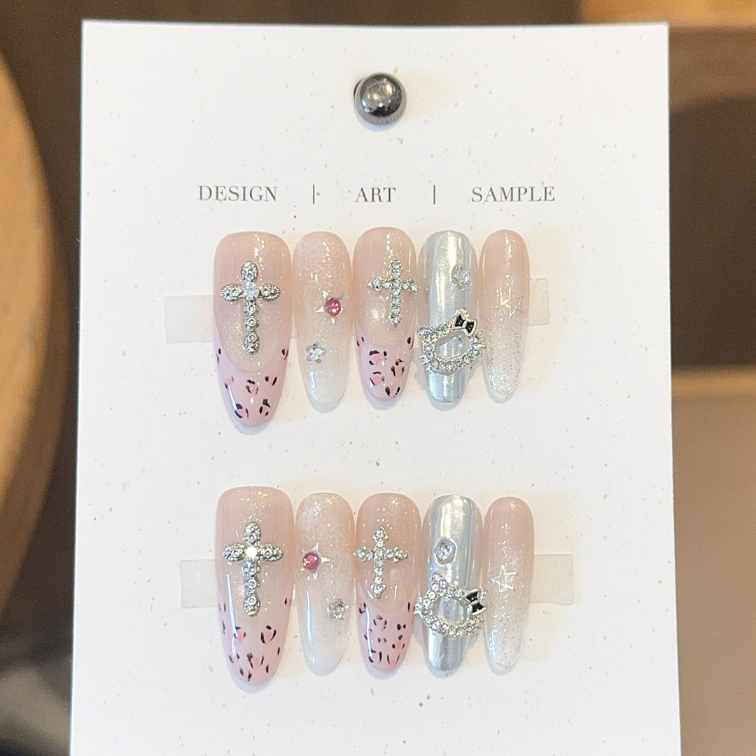 Artificial nails with sparkling rhinestones and cross motifs Kalsten