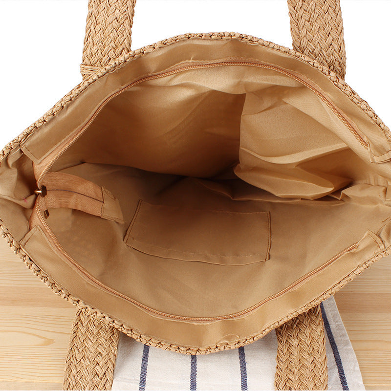 Eco-friendly straw tote bag with elegant tassel detail Kalsten