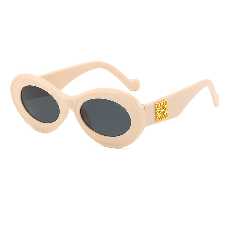 Women's fashionable sunglasses with oval frame and golden applications Kalsten
