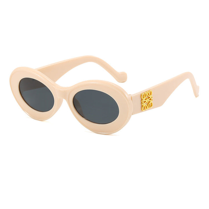 Women's fashionable sunglasses with oval frame and golden applications Kalsten