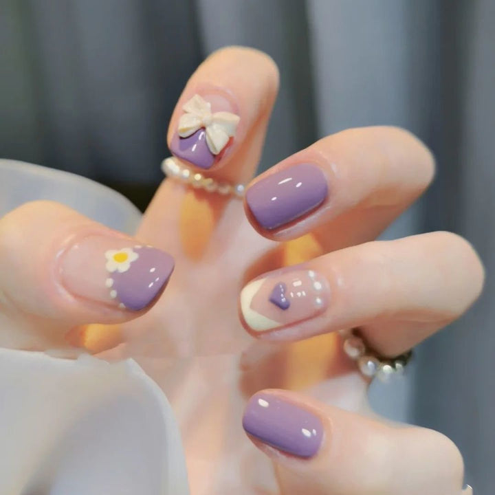 Artificial nails with heart accent and glamorous decorations Kalsten